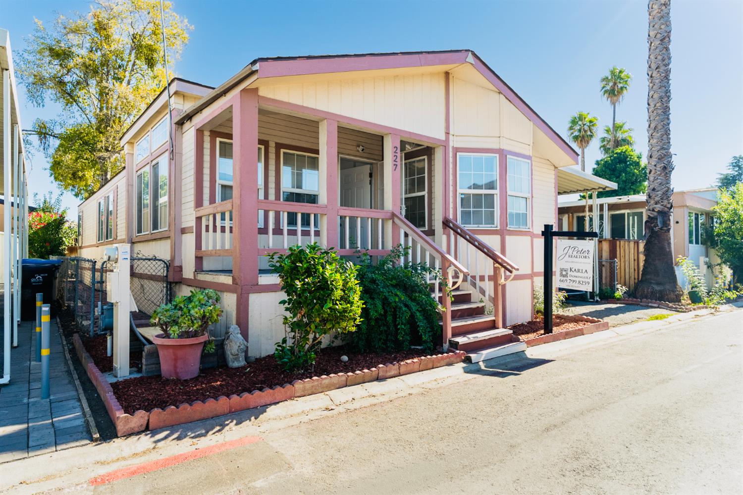 200 Ford Road, Unit 227 San Jose, CA 95138 - Photo 2 of 37 a view of a house with a yard and potted plants