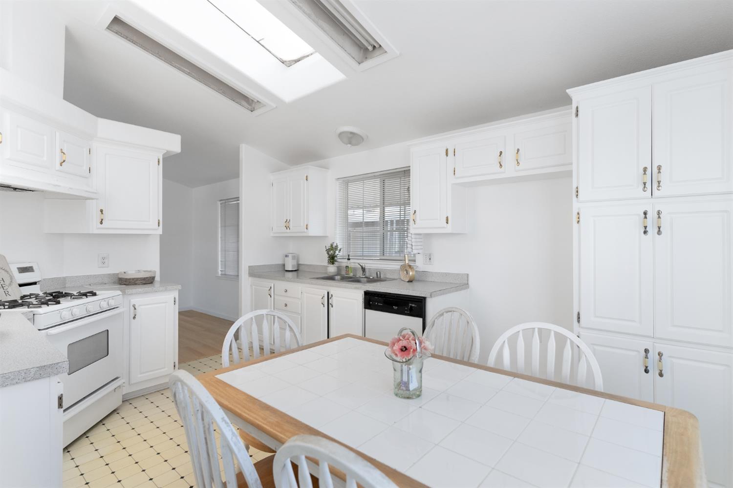 200 Ford Road, Unit 227 San Jose, CA 95138 - Photo 25 of 37 a kitchen with granite countertop a sink stainless steel appliances and cabinets
