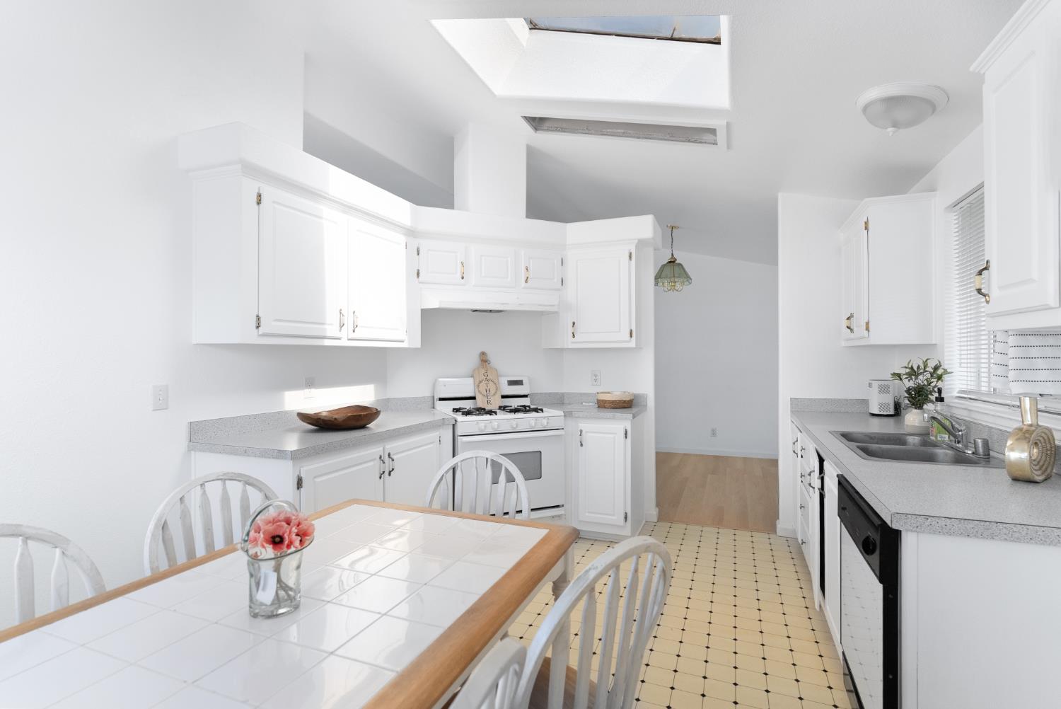 200 Ford Road, Unit 227 San Jose, CA 95138 - Photo 26 of 37 a kitchen with stainless steel appliances granite countertop a sink stove and refrigerator