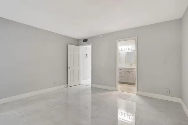 an empty room with a bathroom