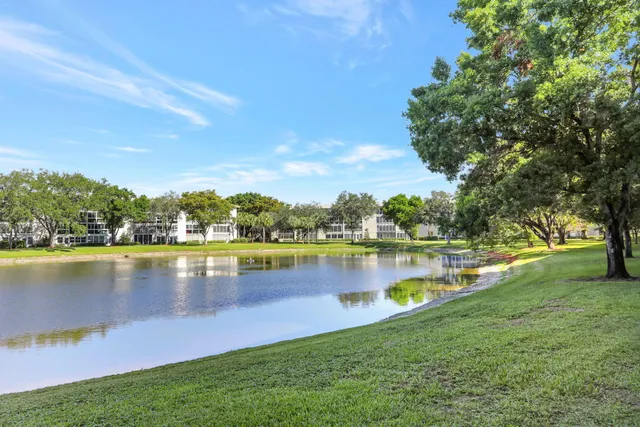 a view of a lake with houses in the back