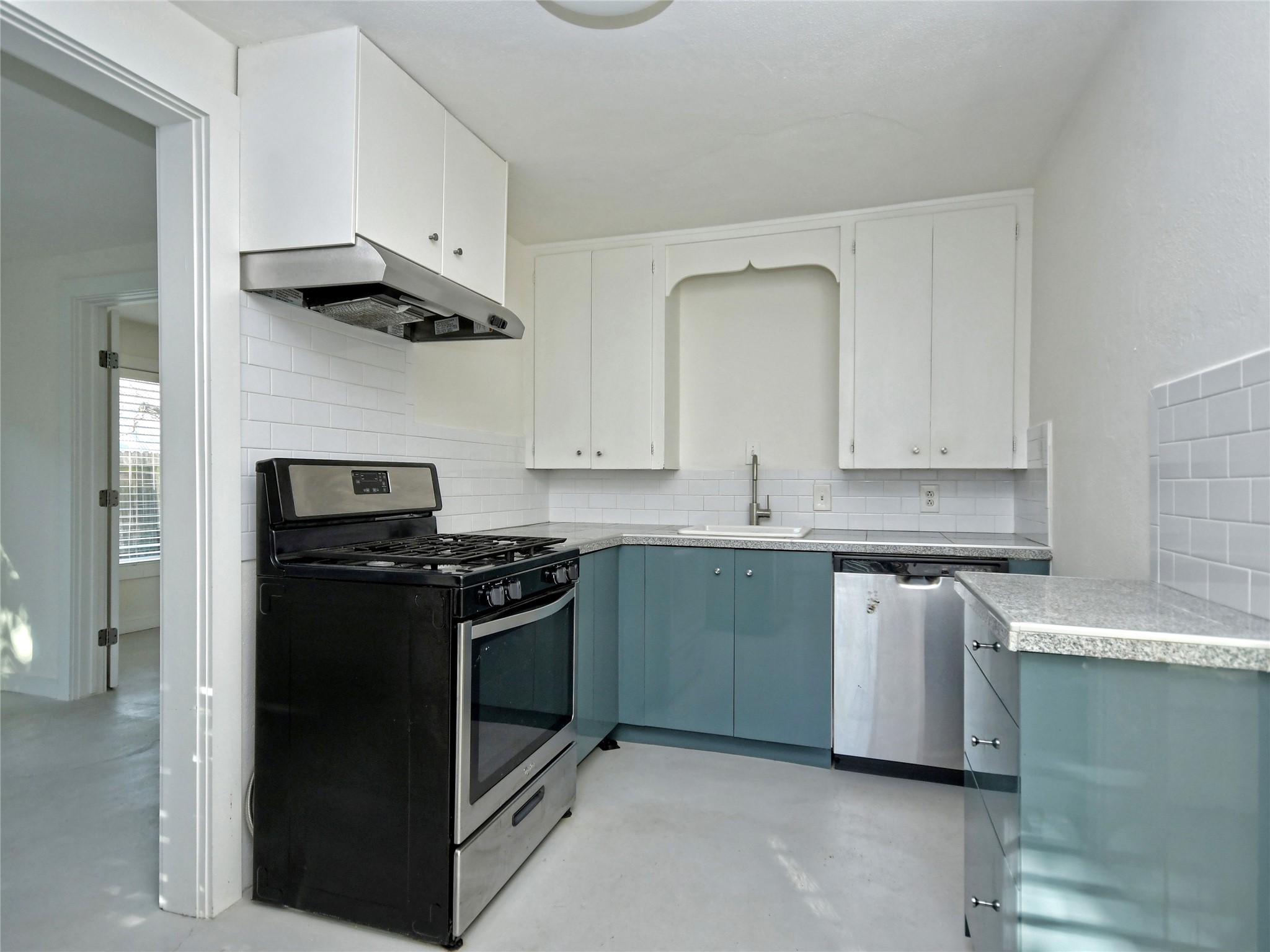 4604 Red River Street, Unit B Austin, TX 78751 - Photo 9 of 15 A well-appointed kitchen features sleek appliances and ample counter space for daily culinary endeavors.