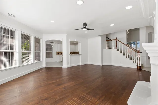 a view of an entryway with wooden floor