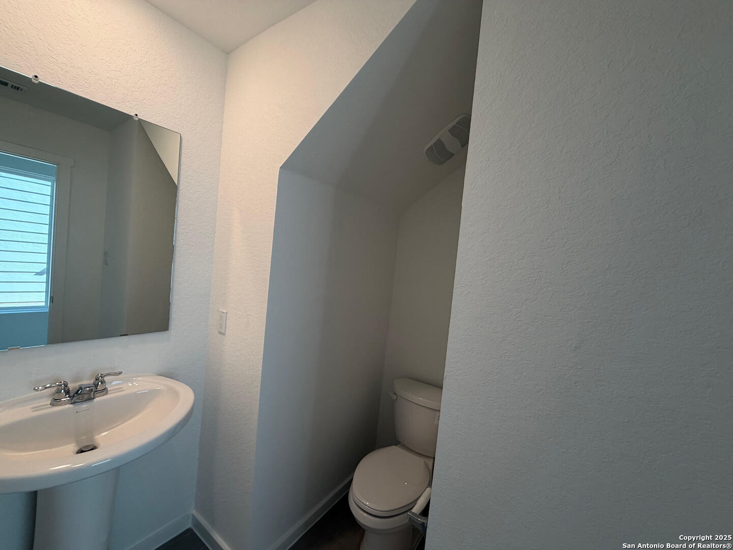 11910 Bluebell Ridge Converse, TX 78109 - Photo 7 of 15 a bathroom with a sink and a toilet