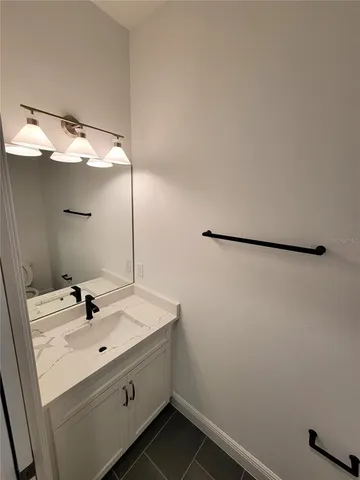 a bathroom with a sink and mirror