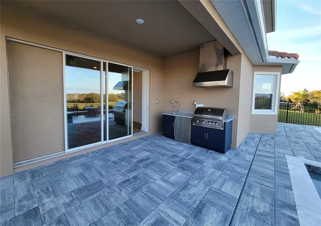 a view of swimming pool with a lounge chair