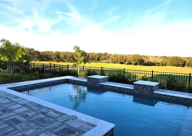 a view of roof deck with lawn chairs with wooden floor