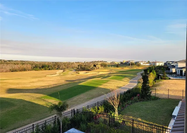 a view of a utility room with cabinets