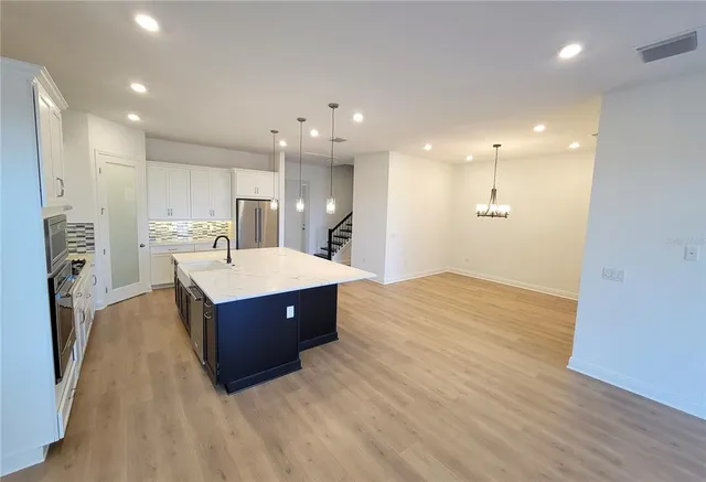 a kitchen with a cabinets and a sink