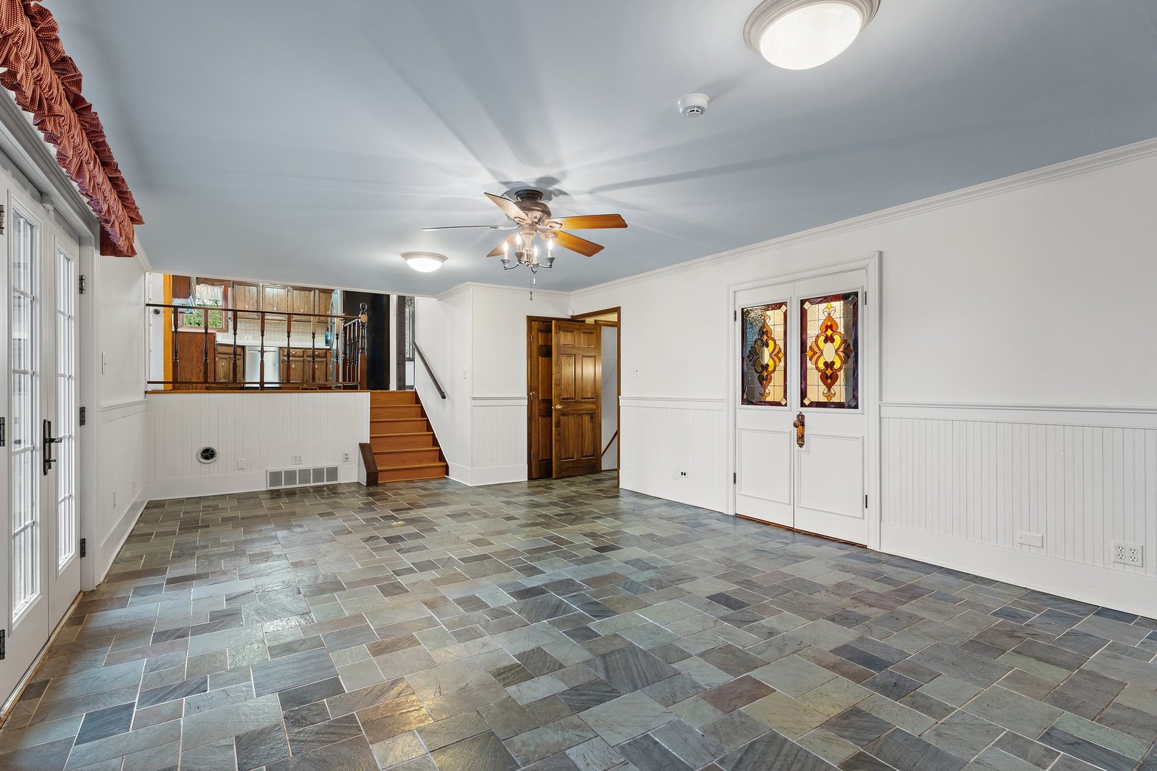 2929 East Danne Road Crete, IL 60417 - Photo 18 of 56 a view of a livingroom with an entryway and a ceiling fan