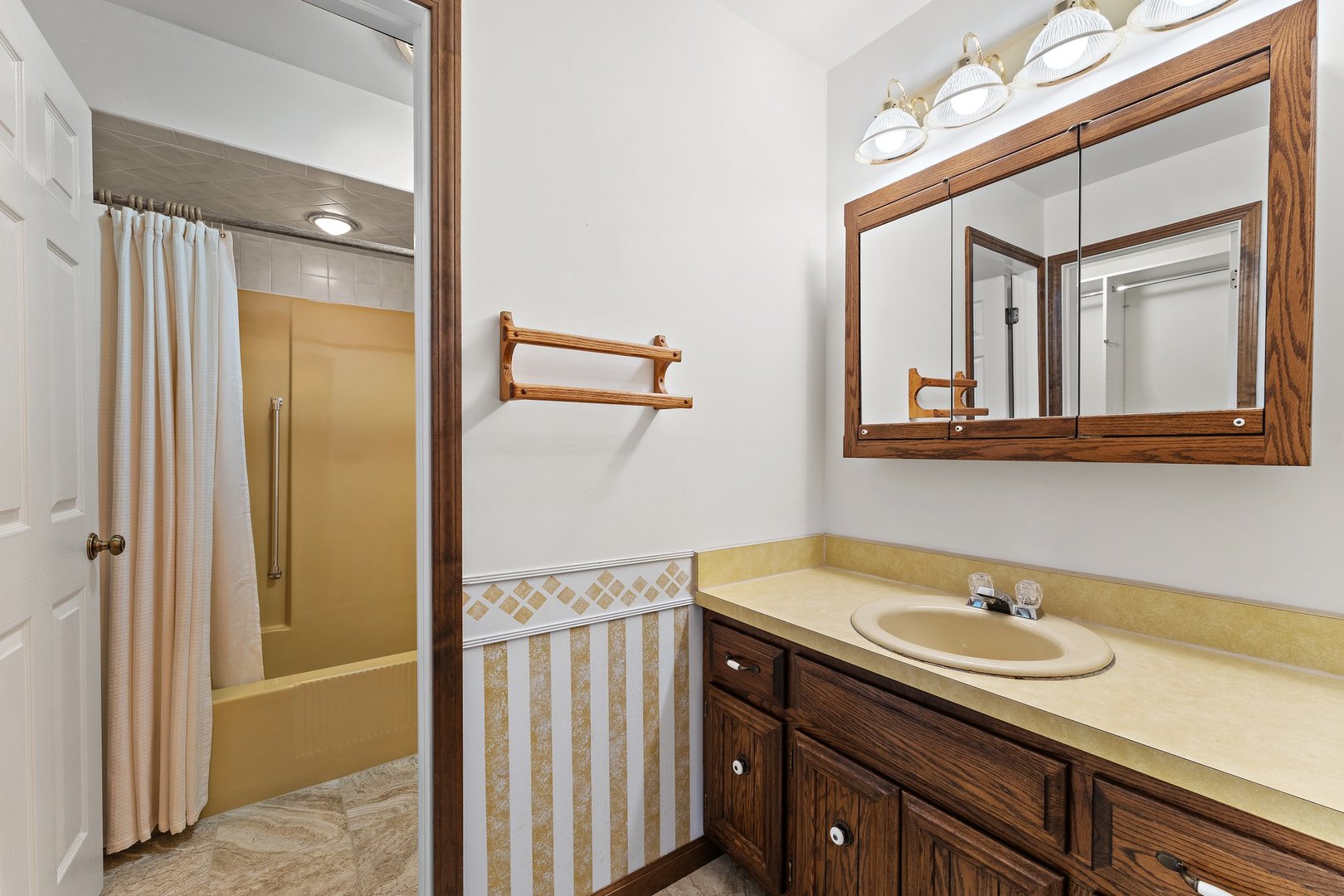 2929 East Danne Road Crete, IL 60417 - Photo 21 of 56 a bathroom with a sink and a mirror