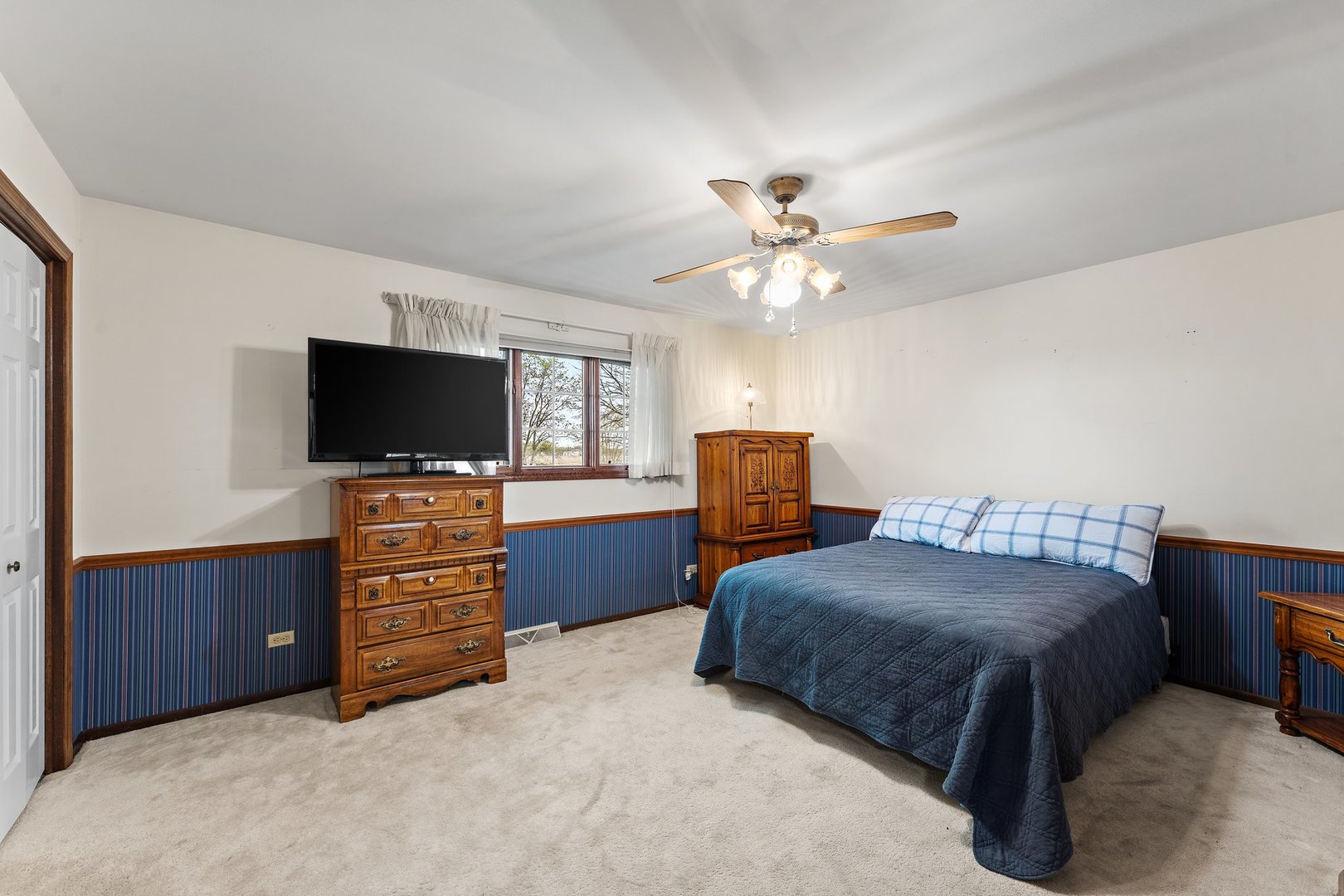 2929 East Danne Road Crete, IL 60417 - Photo 23 of 56 a bedroom with furniture and a flat screen tv