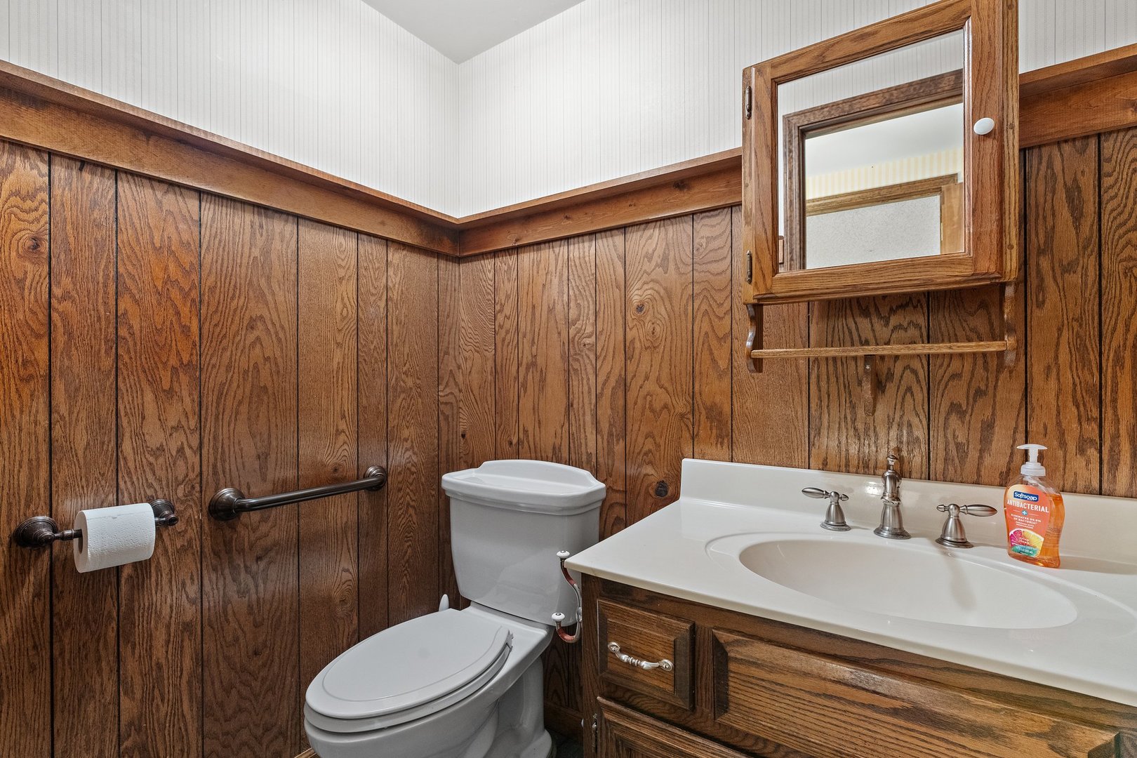 2929 East Danne Road Crete, IL 60417 - Photo 28 of 56 a bathroom with a sink a toilet and shower curtain