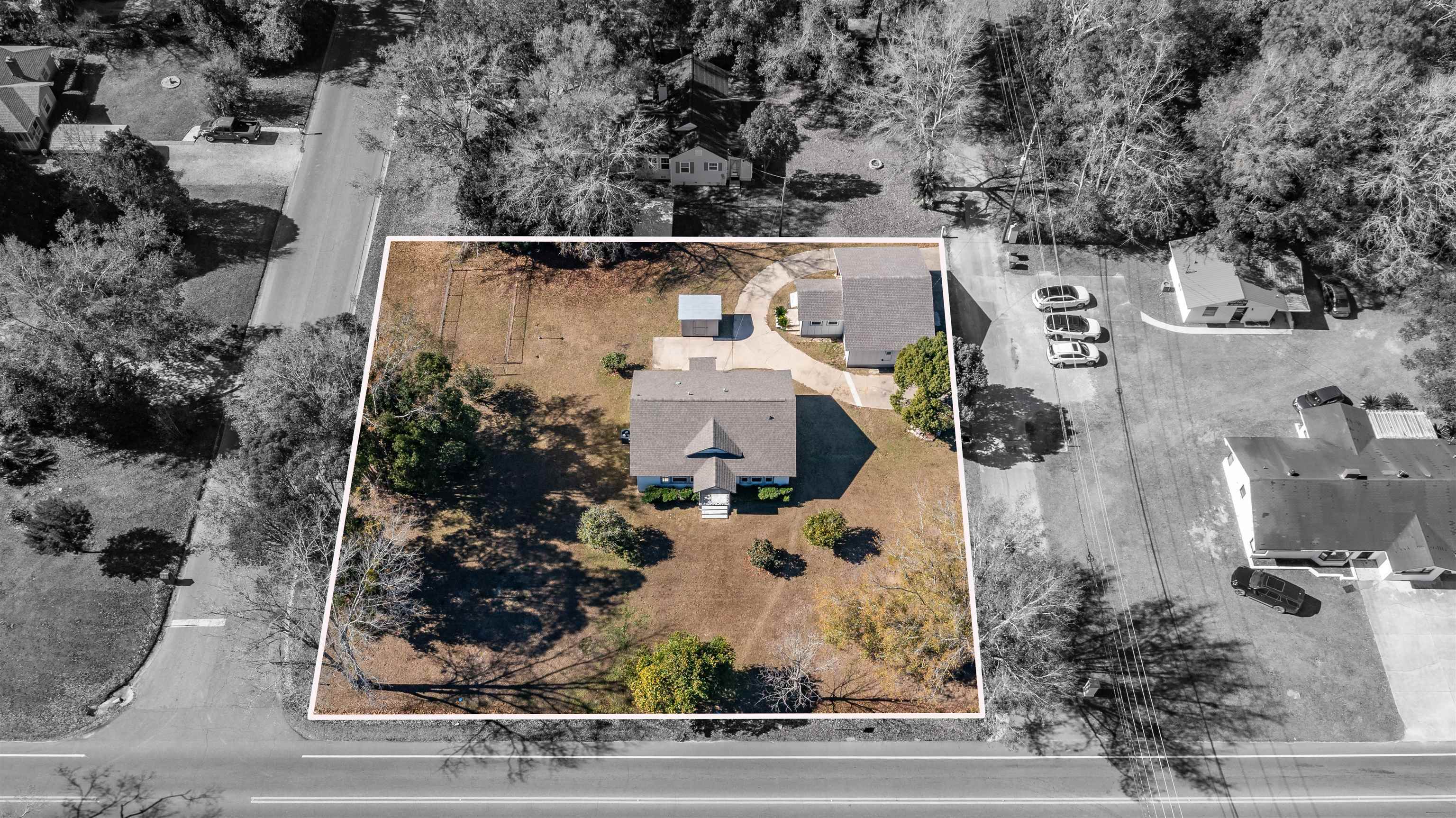 112 South Juniper Street Foley, AL 36535 - Photo 53 of 64 Aerial view of residential area with property boundaries highlighted