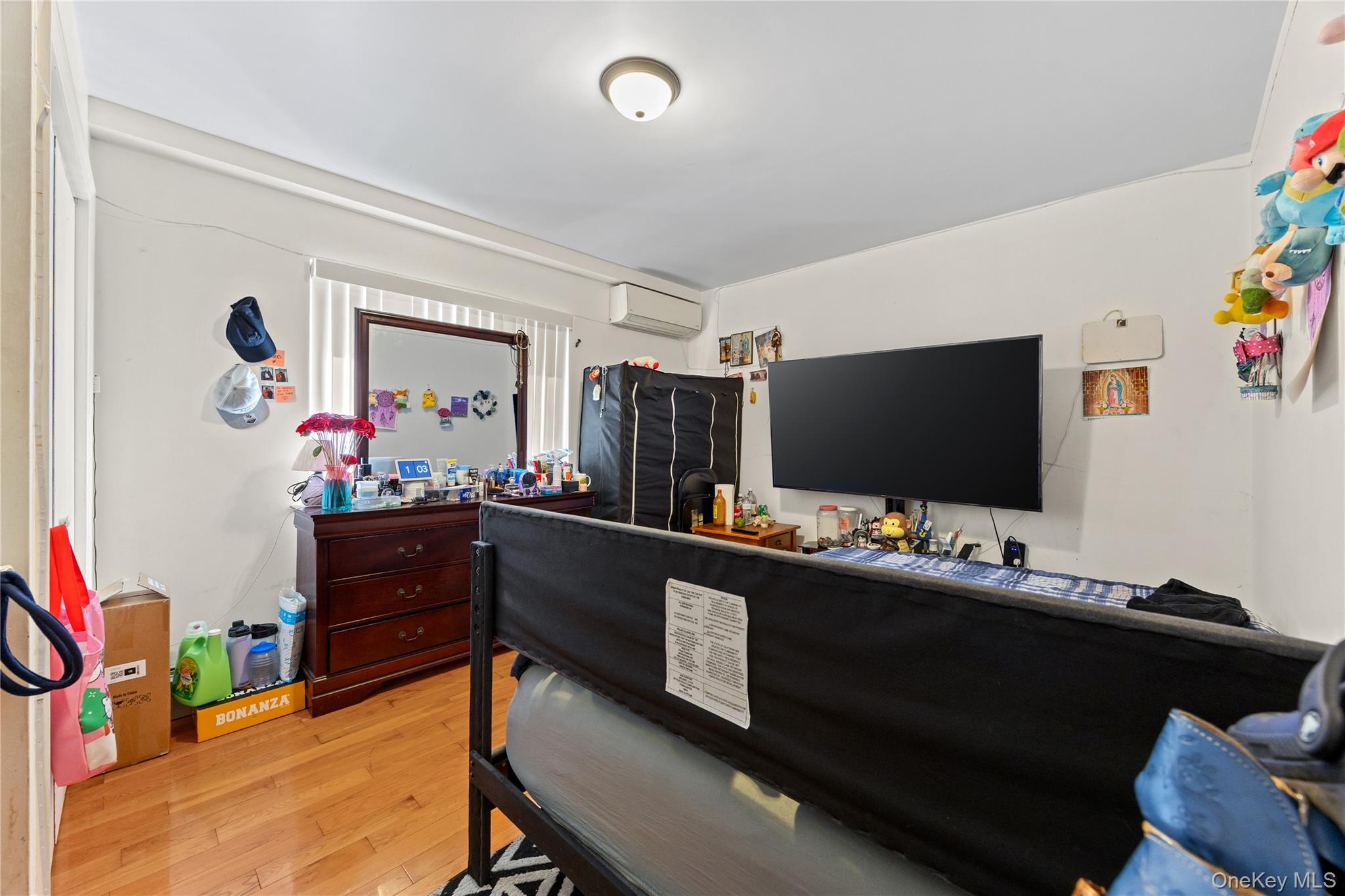 130-06 58th Road Queens, NY 11355 - Photo 12 of 15 a room with furniture and flat screen tv