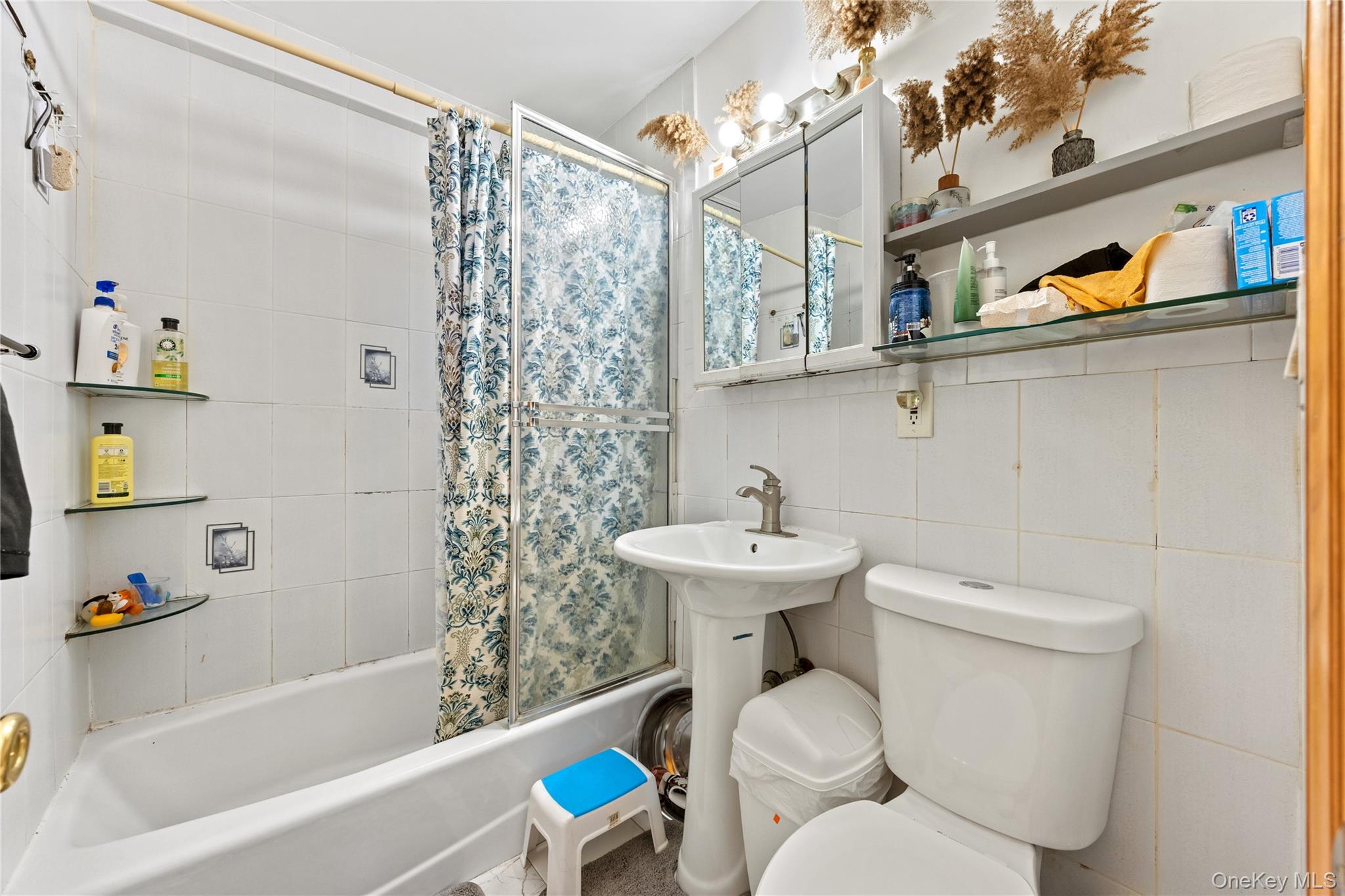 130-06 58th Road Queens, NY 11355 - Photo 4 of 15 a bathroom with a sink a toilet and bathtub