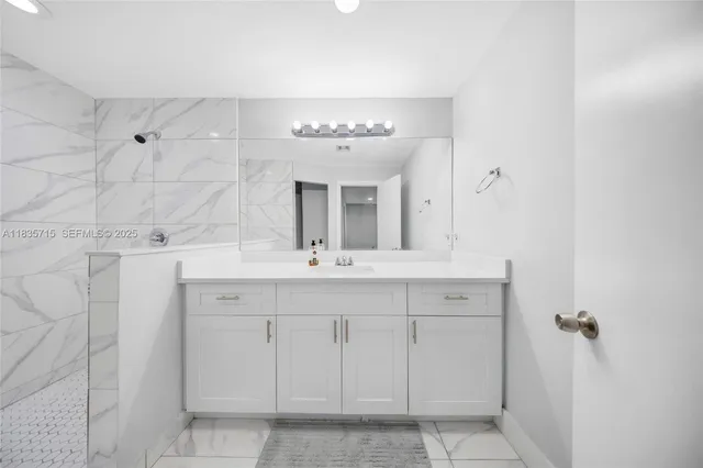 a bathroom with a double vanity sink mirror and double