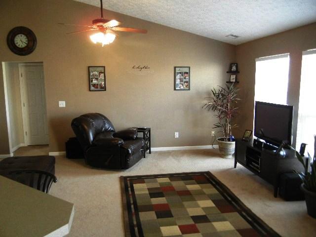 1002 Mallory Lane Spring Hill, TN 37174 - Photo 3 of 20 The great room with vaulted ceilings is open to the kitchen and dining area allowing for family interaction and fun.