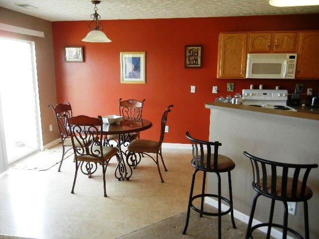 1002 Mallory Lane Spring Hill, TN 37174 - Photo 4 of 20 View back from the great room to the dining area and kitchen counter.