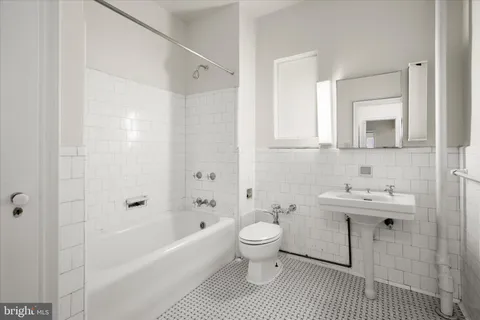 a bathroom with a sink toilet a shower and bathtub