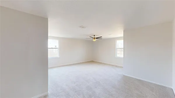 a view of empty room with windows