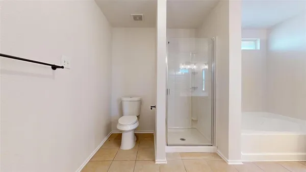 a bathroom with a granite countertop toilet sink and shower