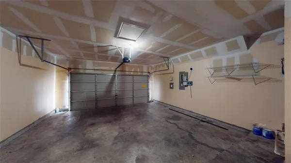 a view of a brick house with a yard