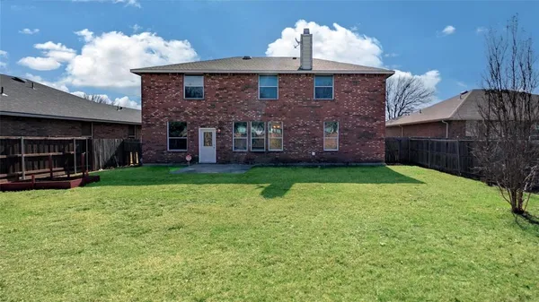 a white bed sitting in a bedroom next to a white cabinet