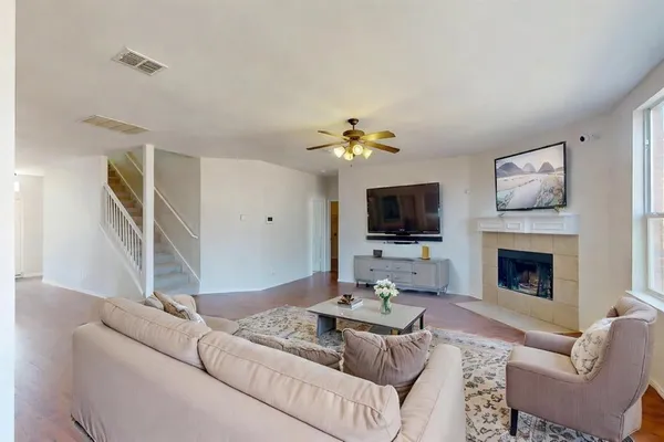 a living room with furniture and a flat screen tv