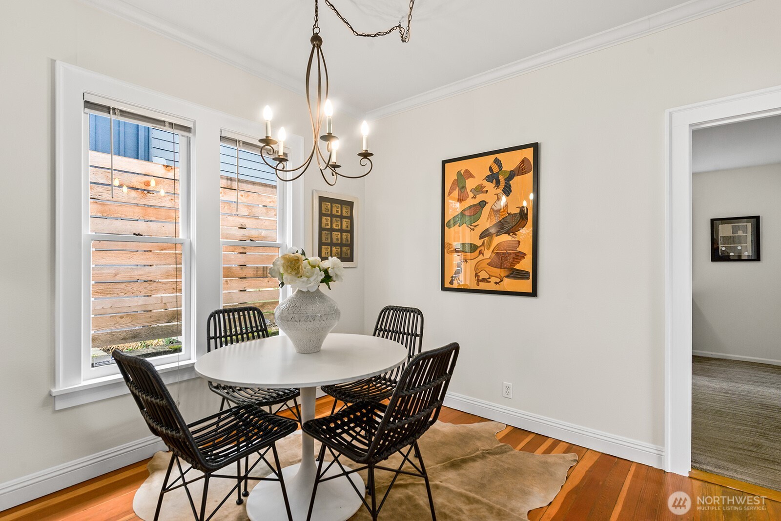 2620 East Roy Street Seattle, WA 98112 - Photo 12 of 27 a view of a dining room with furniture window and wooden floor