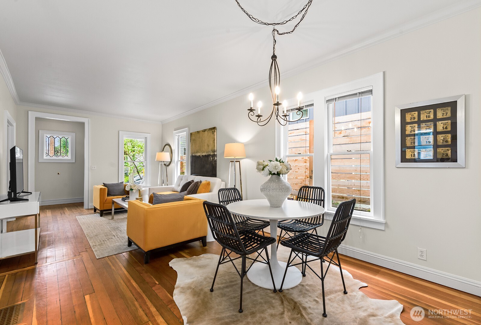 2620 East Roy Street Seattle, WA 98112 - Photo 13 of 27 a view of a dining room with furniture window and wooden floor