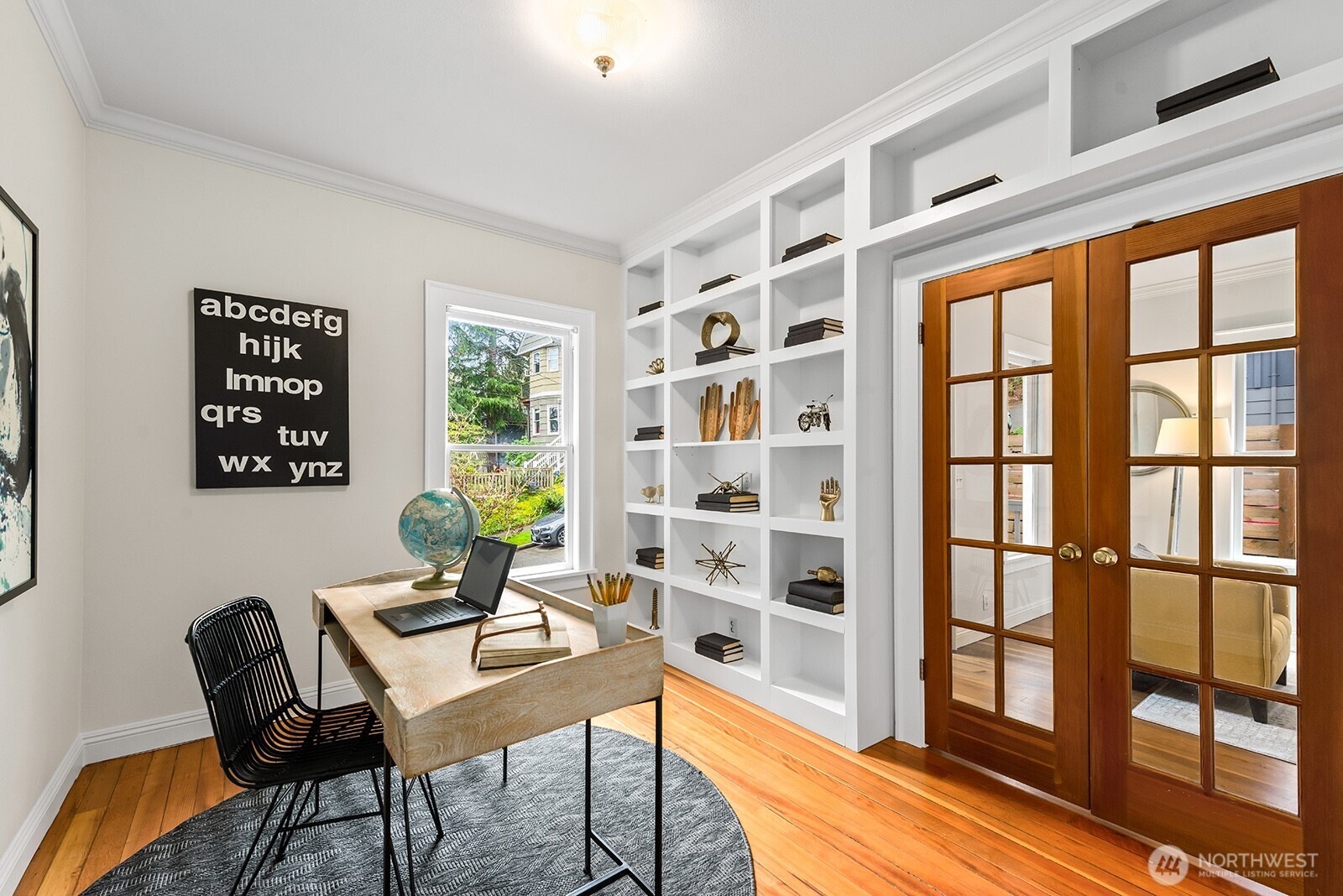 2620 East Roy Street Seattle, WA 98112 - Photo 15 of 27 a workspace with furniture and a window