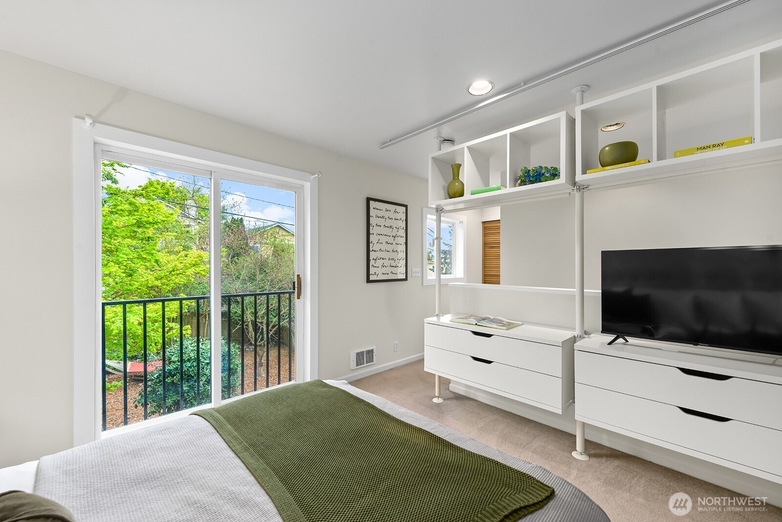 2620 East Roy Street Seattle, WA 98112 - Photo 20 of 27 a bedroom with a bed tv and window