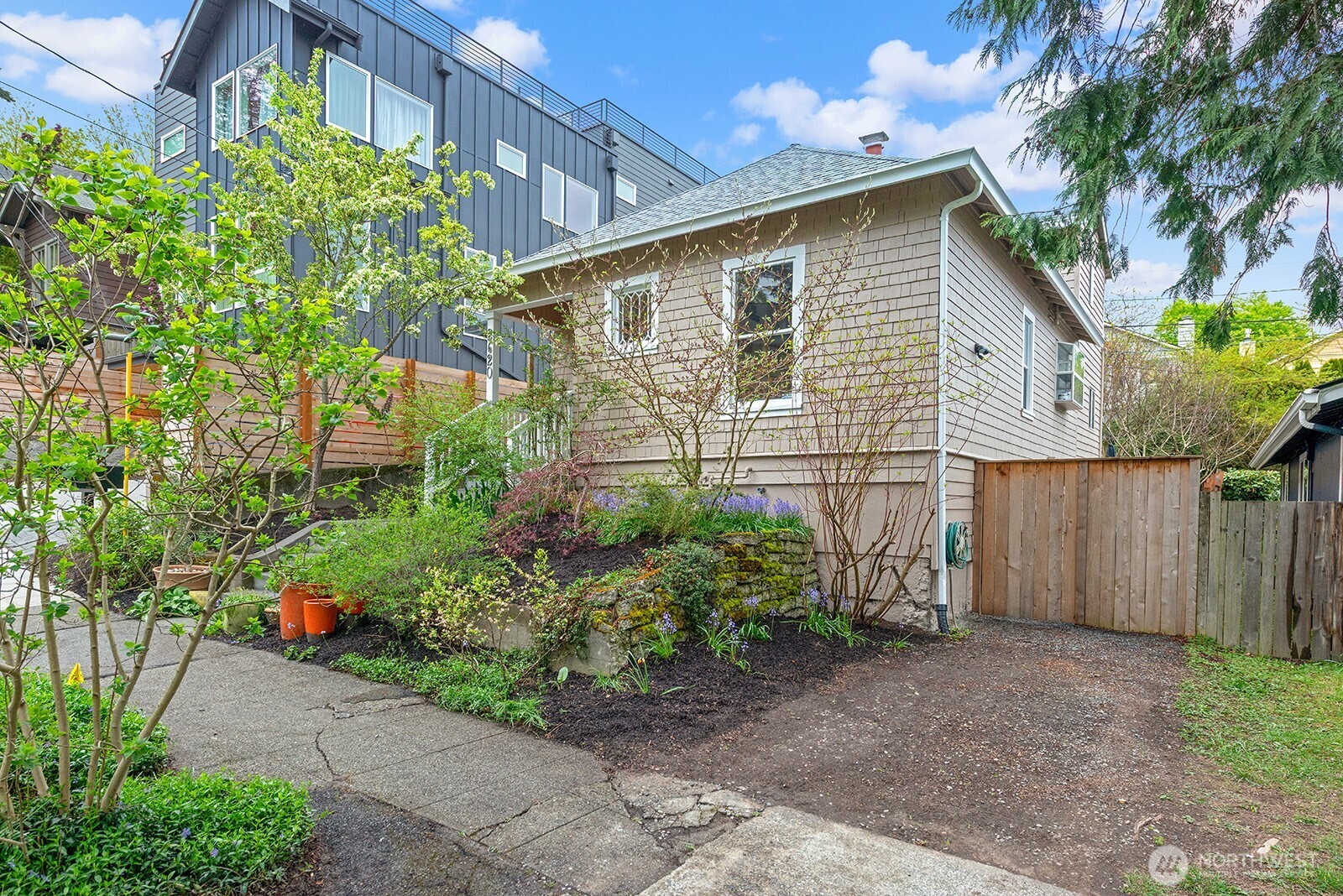 2620 East Roy Street Seattle, WA 98112 - Photo 2 of 27 a front view of a house with garden