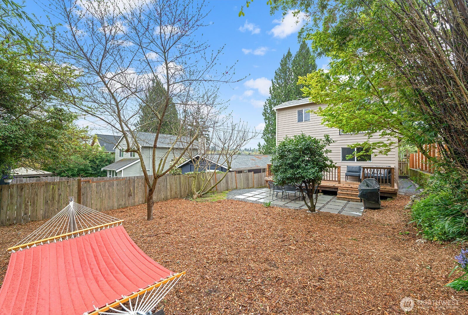2620 East Roy Street Seattle, WA 98112 - Photo 25 of 27 a view of backyard with a table and chairs