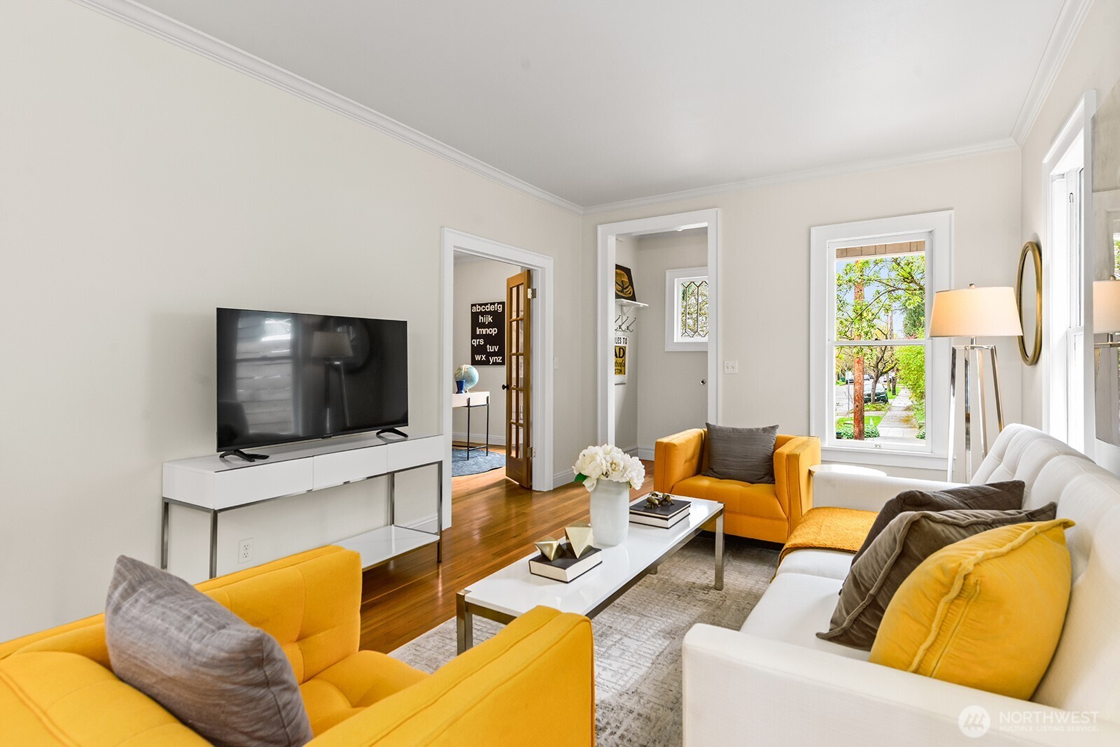 2620 East Roy Street Seattle, WA 98112 - Photo 5 of 27 a living room with furniture and a flat screen tv