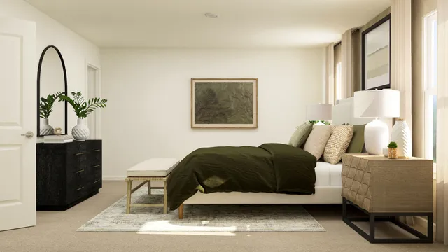 a bedroom with a bed and a dresser