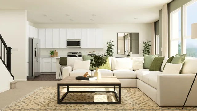 a living room with furniture fireplace and a large window
