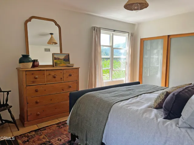 a view of a house with patio and a yard