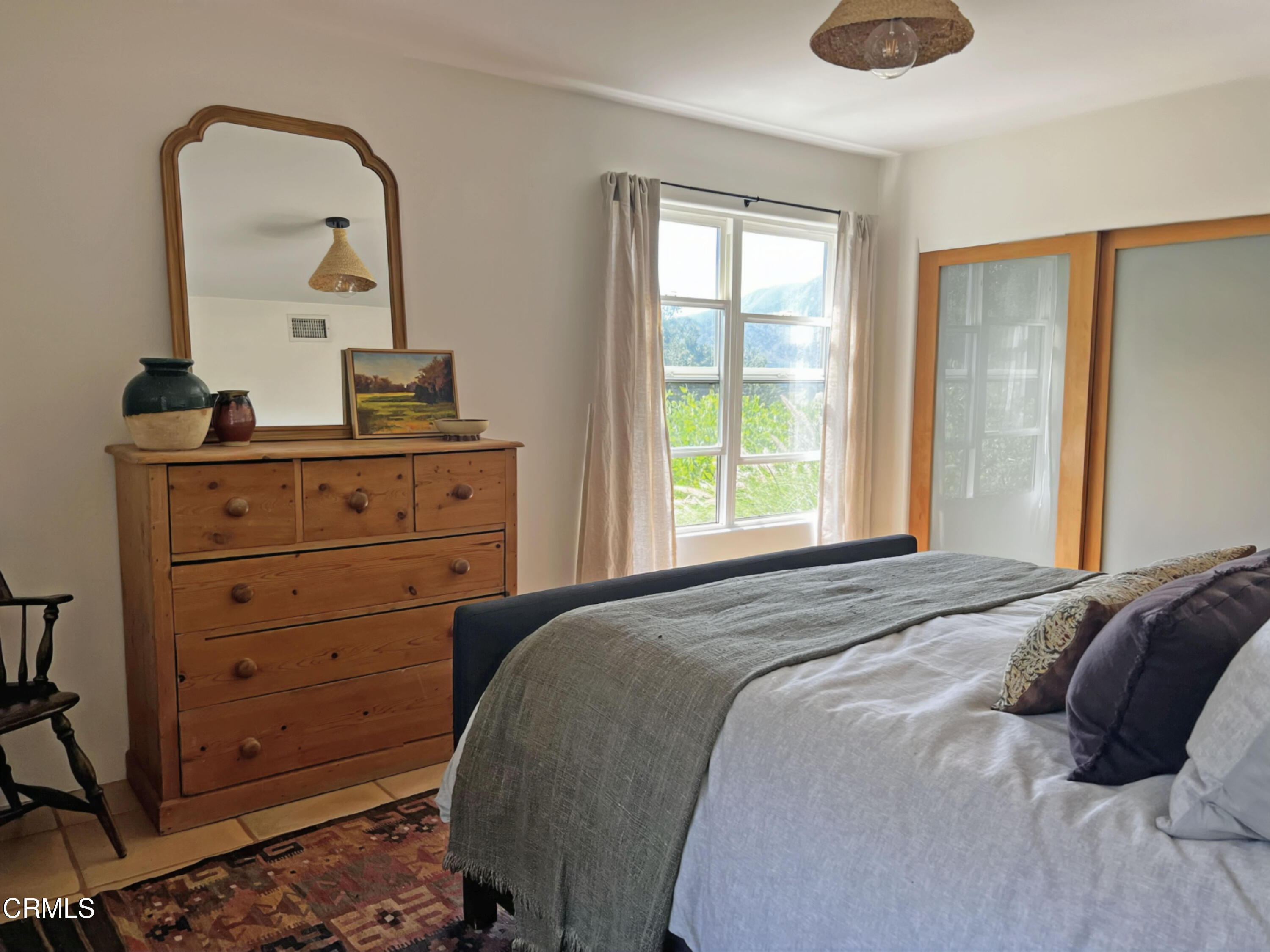 3000 East Ojai Avenue Ojai, CA 93023 - Photo 17 of 34 a bedroom with a bed and a dresser