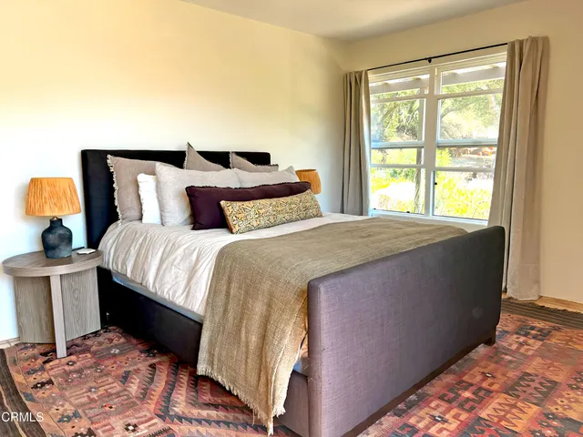 a view of a house with swimming pool and sitting area