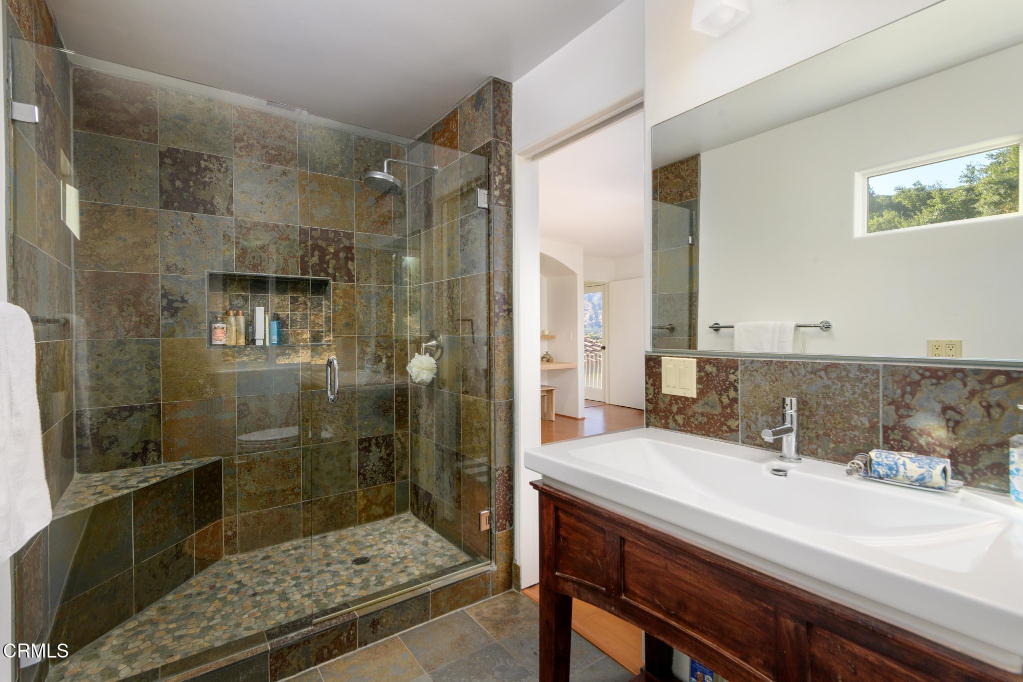3000 East Ojai Avenue Ojai, CA 93023 - Photo 22 of 34 a bathroom with a sink and a mirror