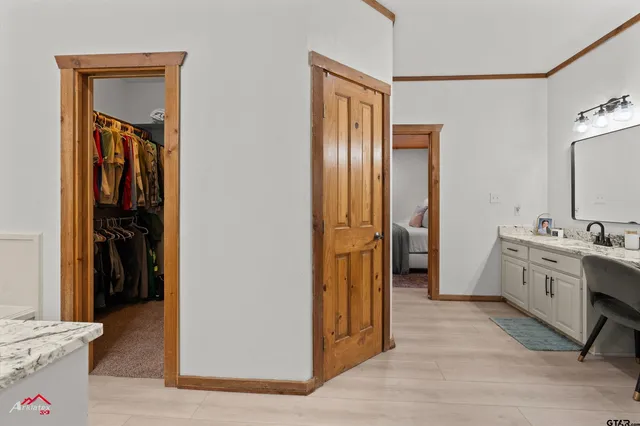 a bathroom with a sink a mirror and a shower