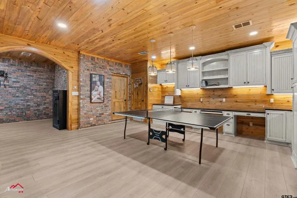 a view of a kitchen with a table and chairs