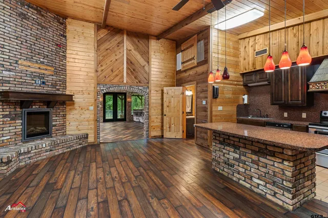 an outdoor space with wooden floor