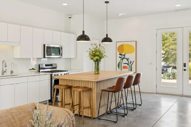 a view of a workspace with furniture