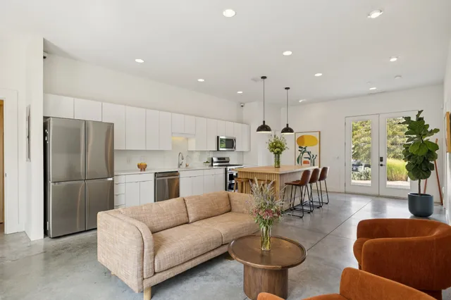 a bathroom with a glass door and shower