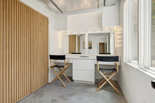 a view of a bathroom from a corridor