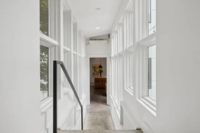 a view of a street with a cars park