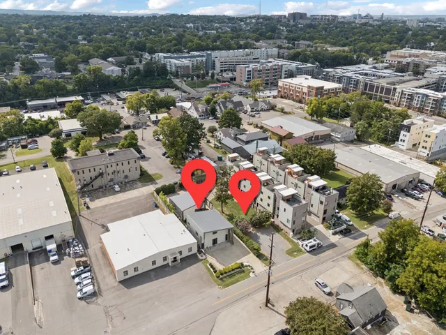 a view of a patio with table and chairs with wooden floor and fence